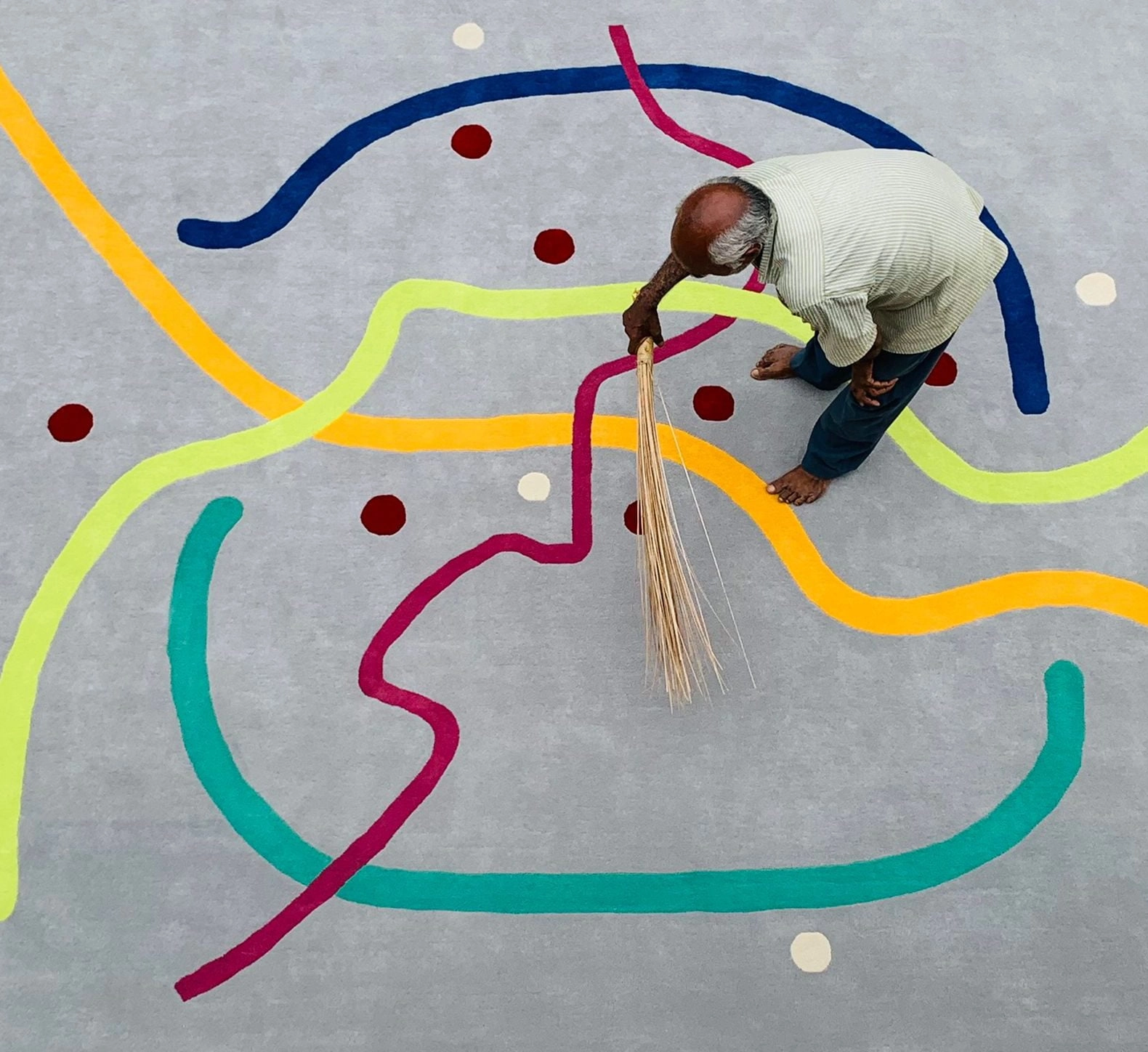 A detailed look at a bespoke rug design showcasing selected colors and materials alongside a design concept.