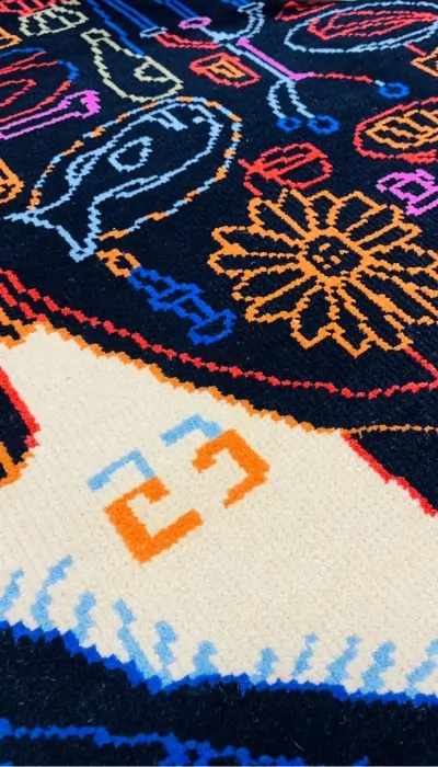 A bespoke rug with flowing curved stripes in pastel tones, creating a cozy yet contemporary look.Designed by Dennis Kwasny and Ella Hartweger.