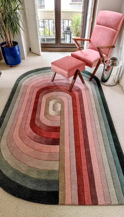 A bespoke rug with flowing curved stripes in pastel tones, creating a cozy yet contemporary look.Designed by Dennis Kwasny and Ella Hartweger.
