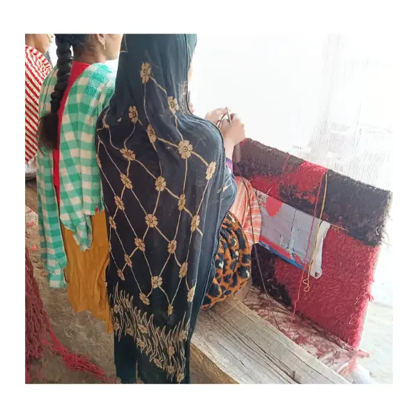 Weaving the bespoke rug by hand.