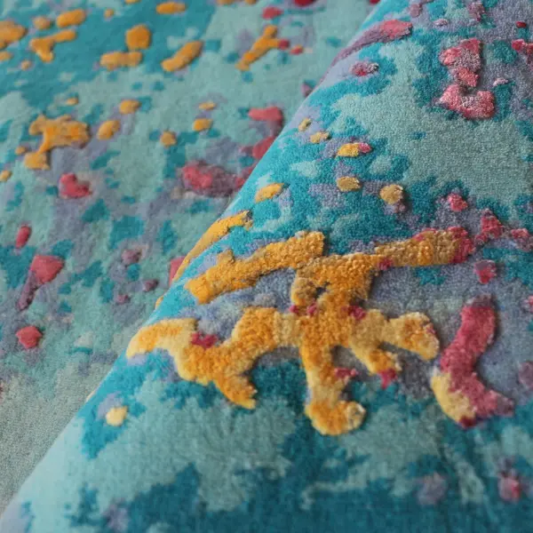 Blue and yellow rug with wool base and Tencel accents in higher pile