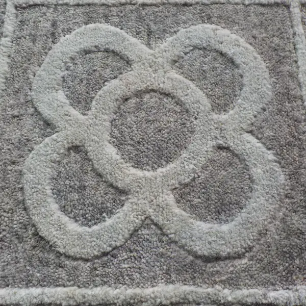 Closeup to a handknotted bespoke rug with slightly different pile heights