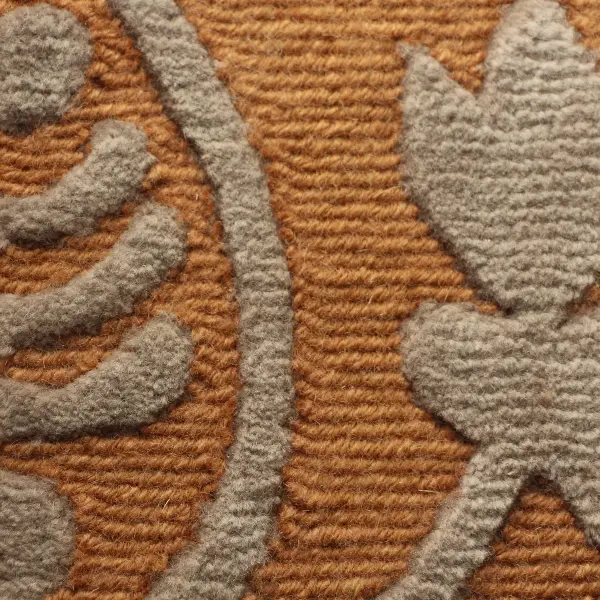 Handknotted rug combining loop pile in low pile with cut pile in high pile, front view