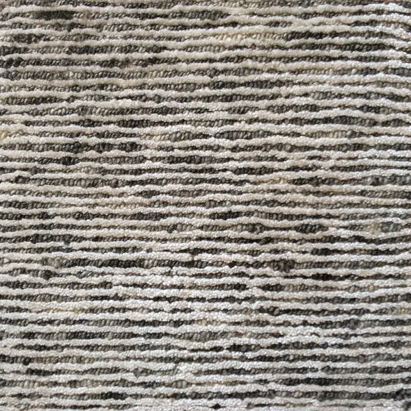 Handmade rug alternating white silk and undyed wool.