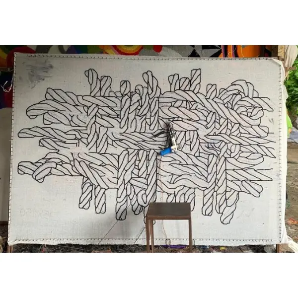 Handtufted rug in the making