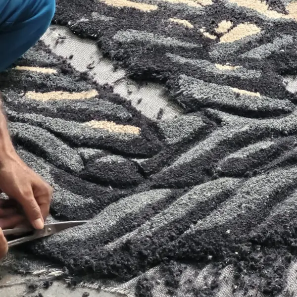 Sculpting the rug in different pile heights and shapes