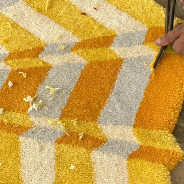 Yellow and white star rug by Annika Johansson before carving