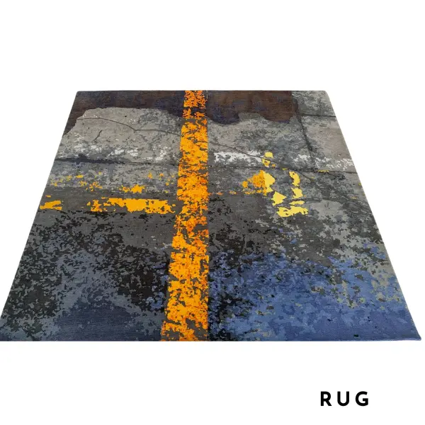 Gros plan sur un tapis fait main sur mesure en gris et jaune d'après la photo d'un sol d'usine du client.