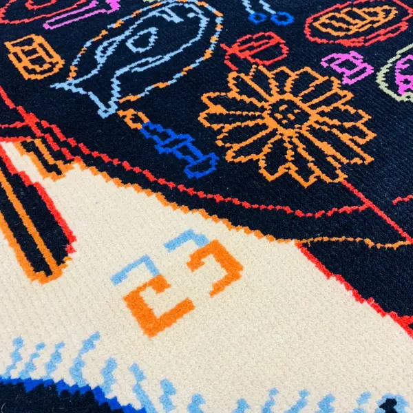Handknotted rug with black dining table and colourful items in Paris