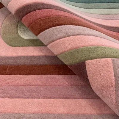 Handtufted rug in pink, cream, and green gradients to match the interior in the master bedroom. With spiral, curved shape