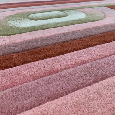 Handtufted rug in pink, cream, and green gradients to match the interior in the master bedroom. With spiral, curved shape (7)